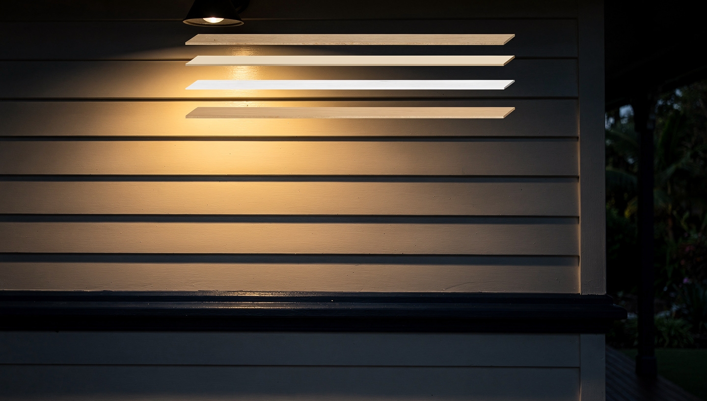 Raking work light skimming a finished weatherboard wall, exploded layer stack above